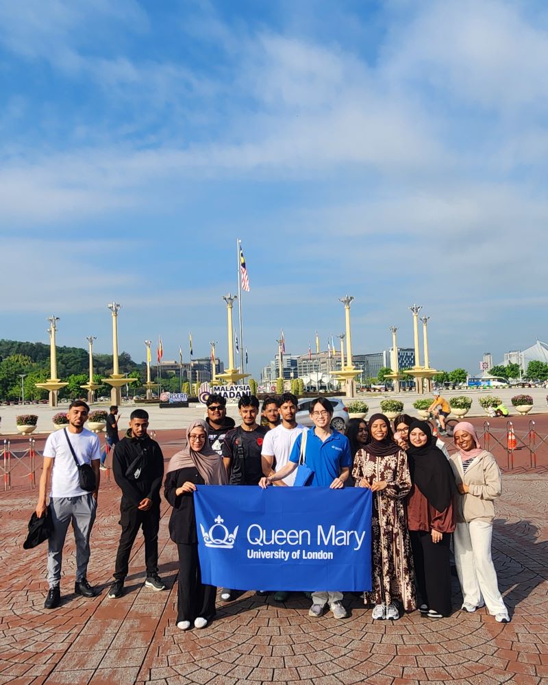 Our GLobal Leadership Summer Programme 2025 students holding QMUL banner in Malyasia